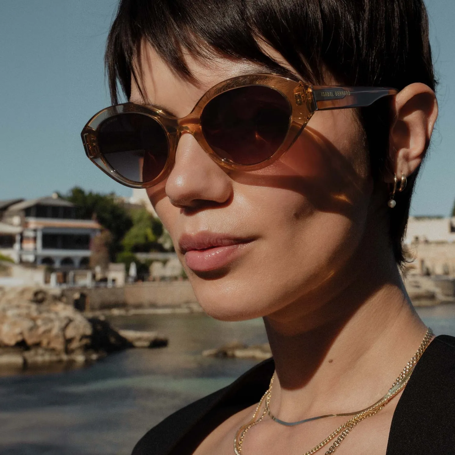 La Villette Rosaire transparant beige ovale zonnebril met bruine gradient glazen