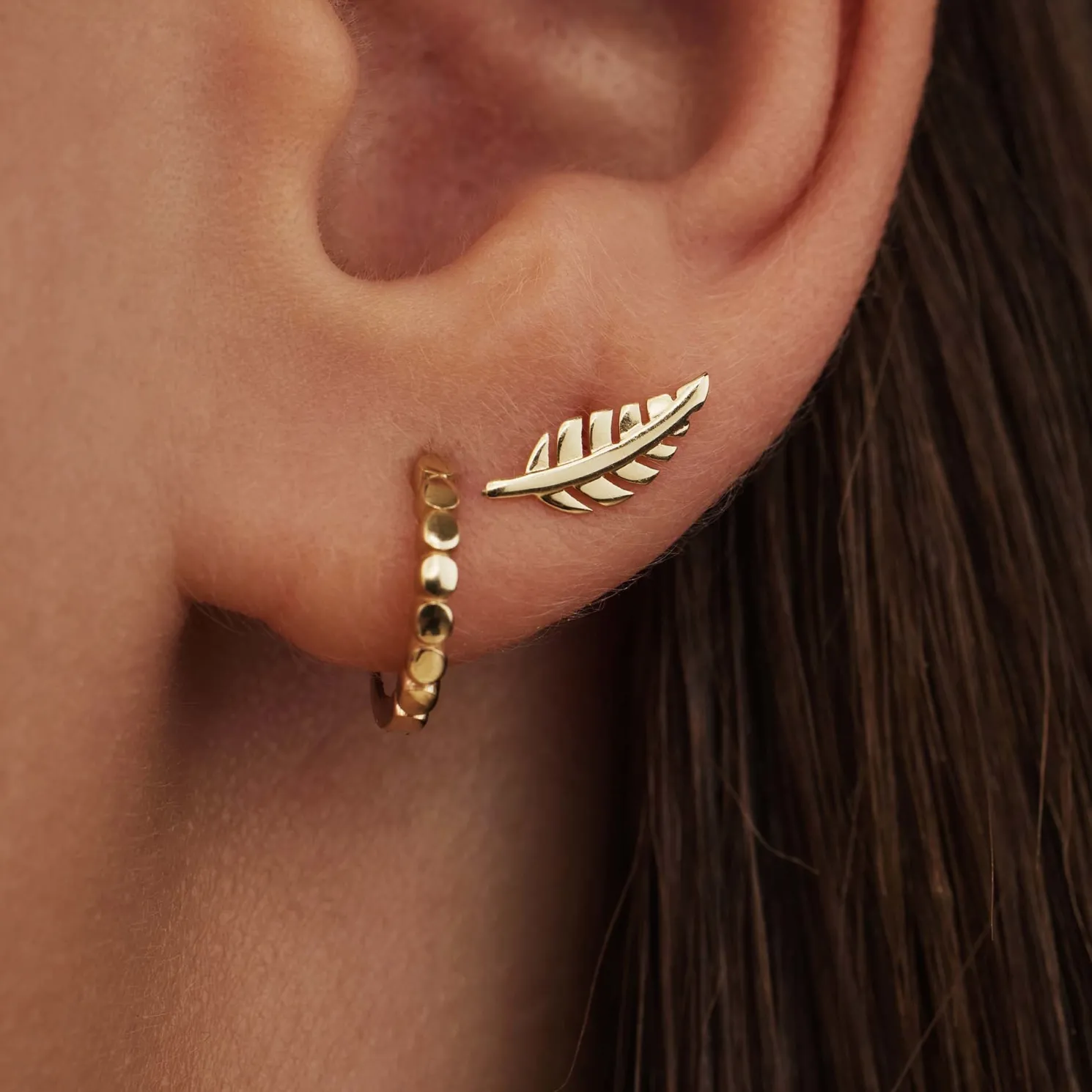 Monceau Giselle 14 karaat gouden oorknoppen met veertje