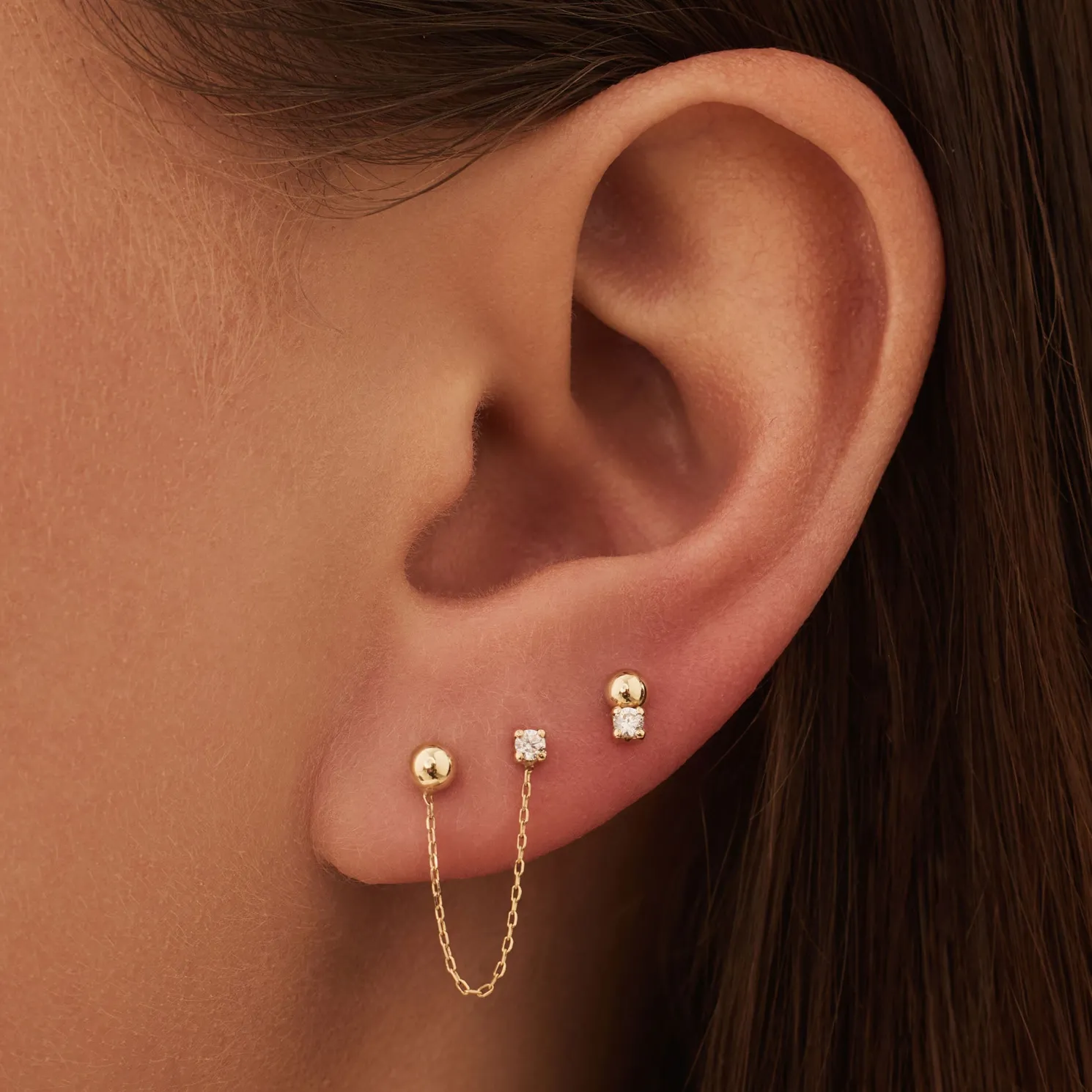 Rivoli Cézanne 14 karaat gouden oorbellen met 3 oorknoppen